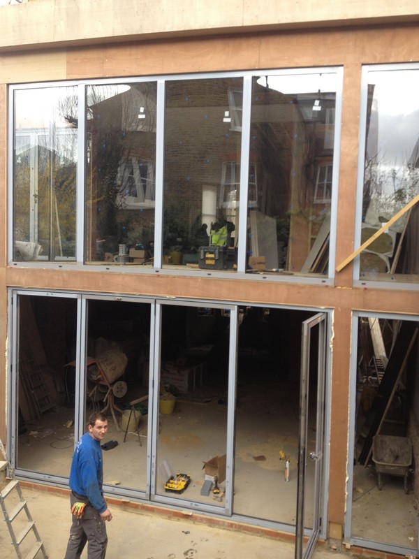 Aluminium bi-fold doors with two-storey glazing in Tring