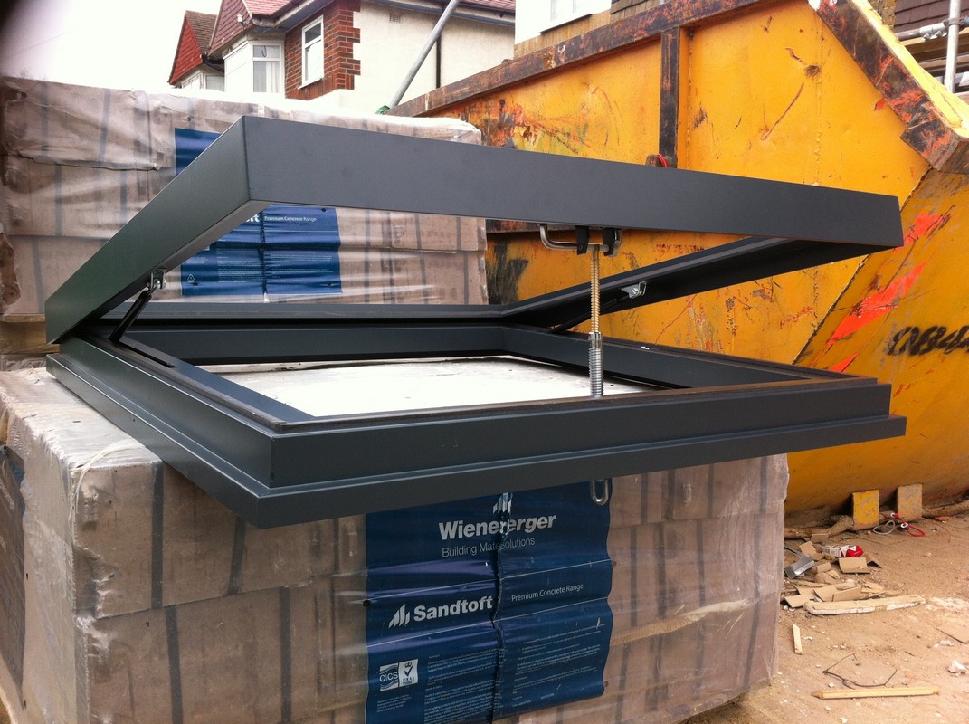 Opening flat roof skylight in anthracite grey installed in Tring